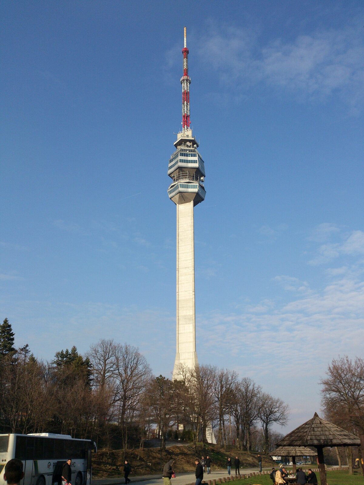 The rebuilt Avala Tower seen from ground level, from its three-legged base to the antenna mast