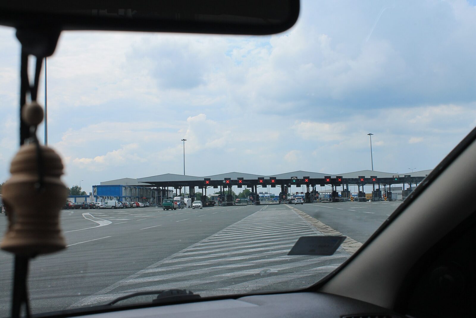 The Batrovci road border crossing between Croatia and Serbia, with lanes of traffic approaching the checkpoint
