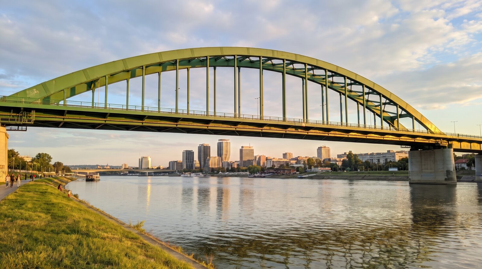 A bridge over the Sava river, with the towers of Novi Beograd in the background