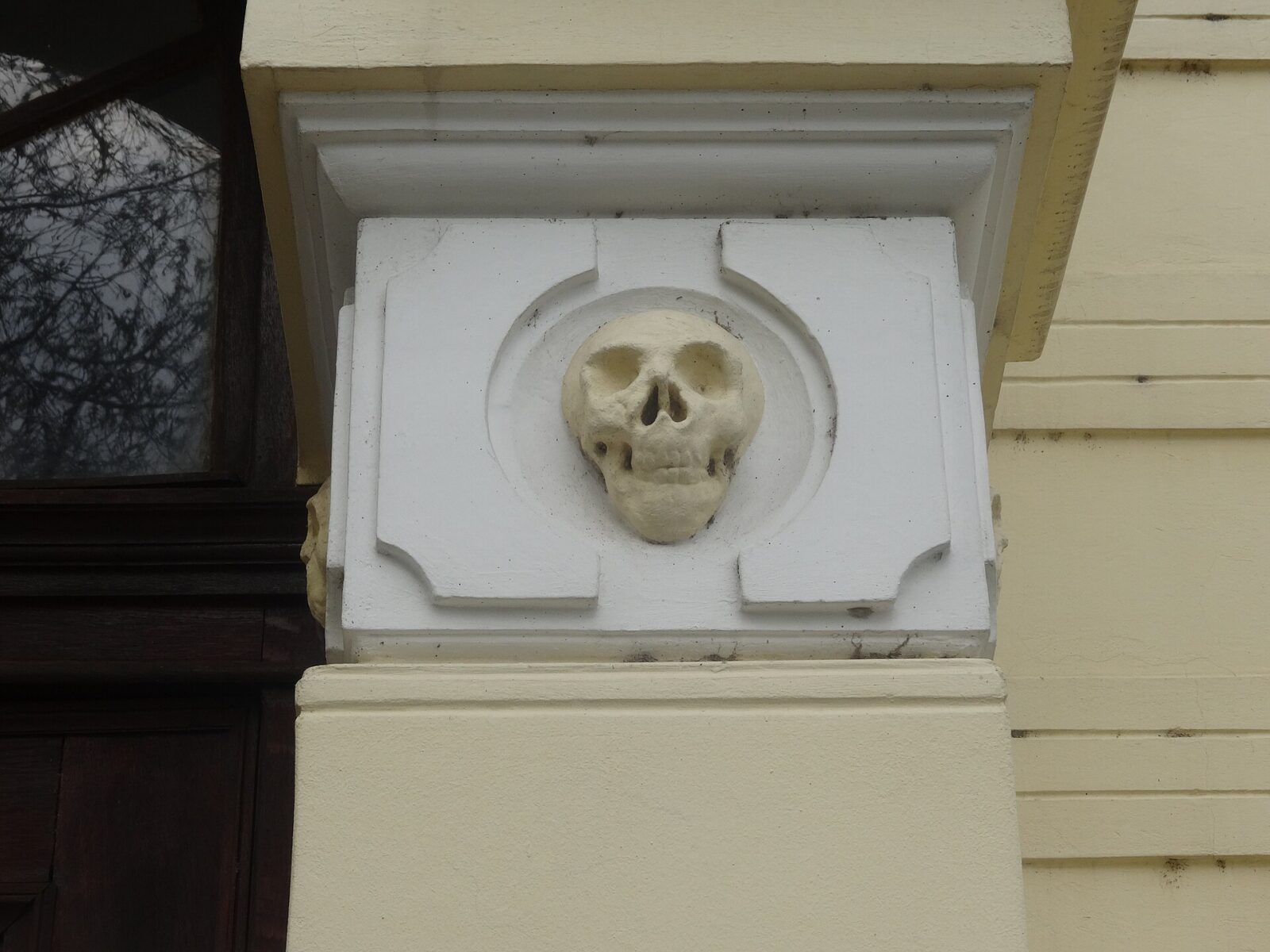 A carved skull set above the chapel's entrance doorway at the Skull Tower