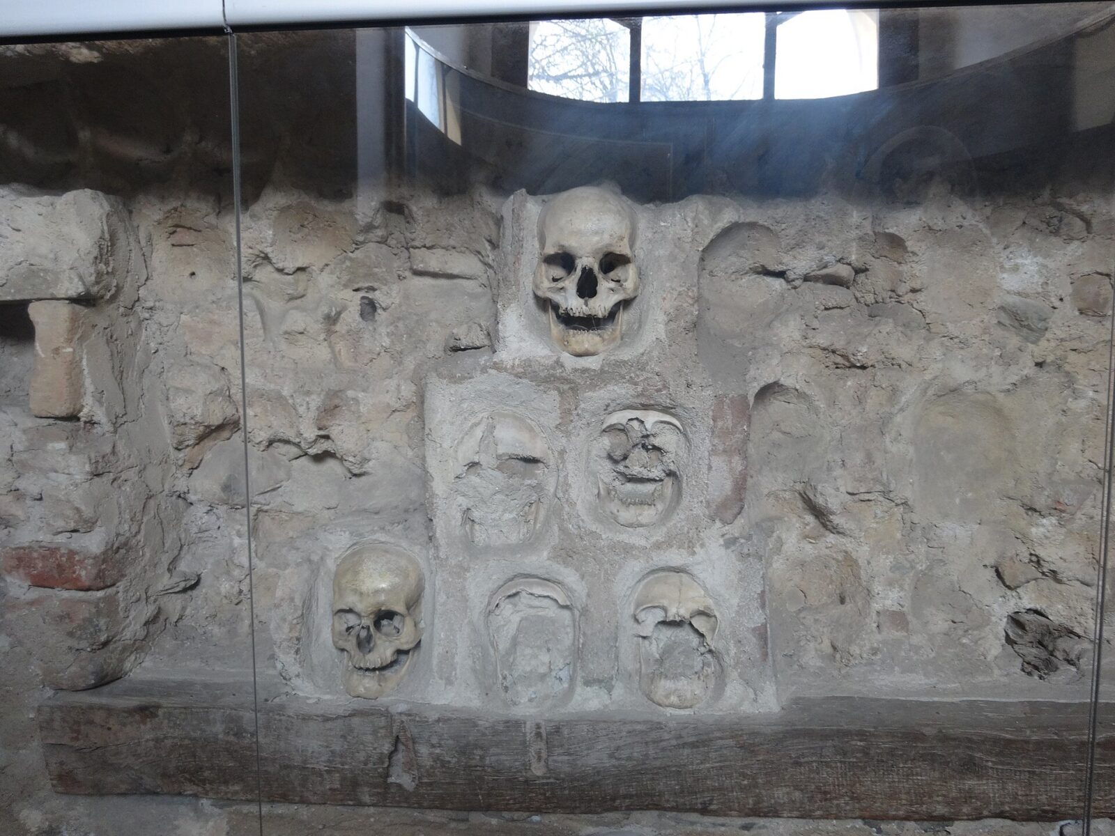 Skulls set into the preserved section of wall inside the Skull Tower chapel