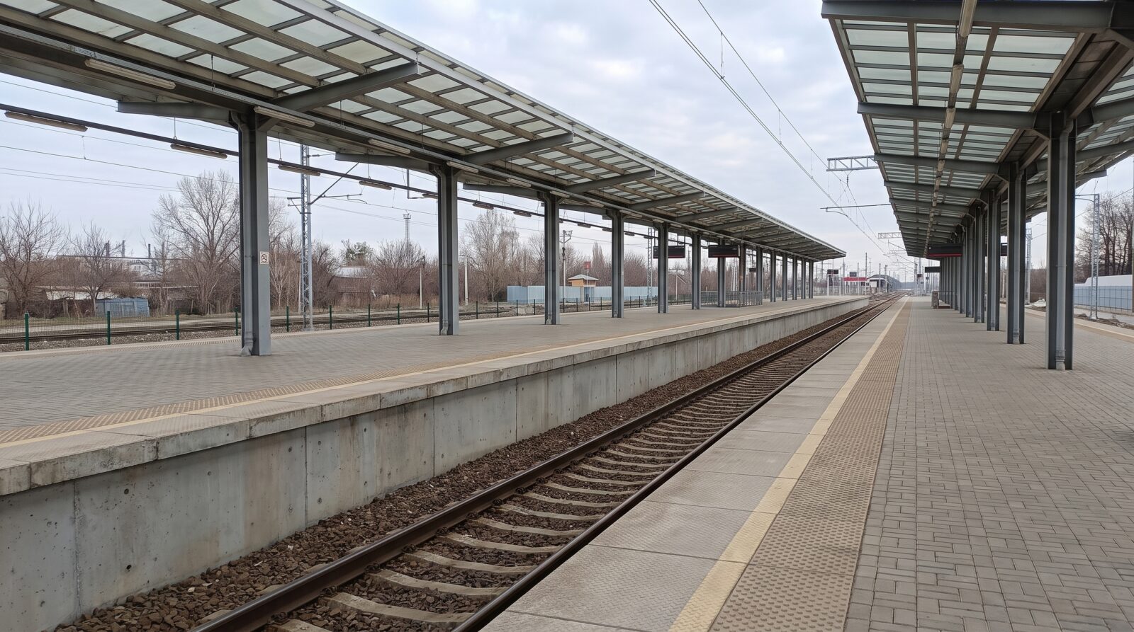 An empty railway platform seen from a distance