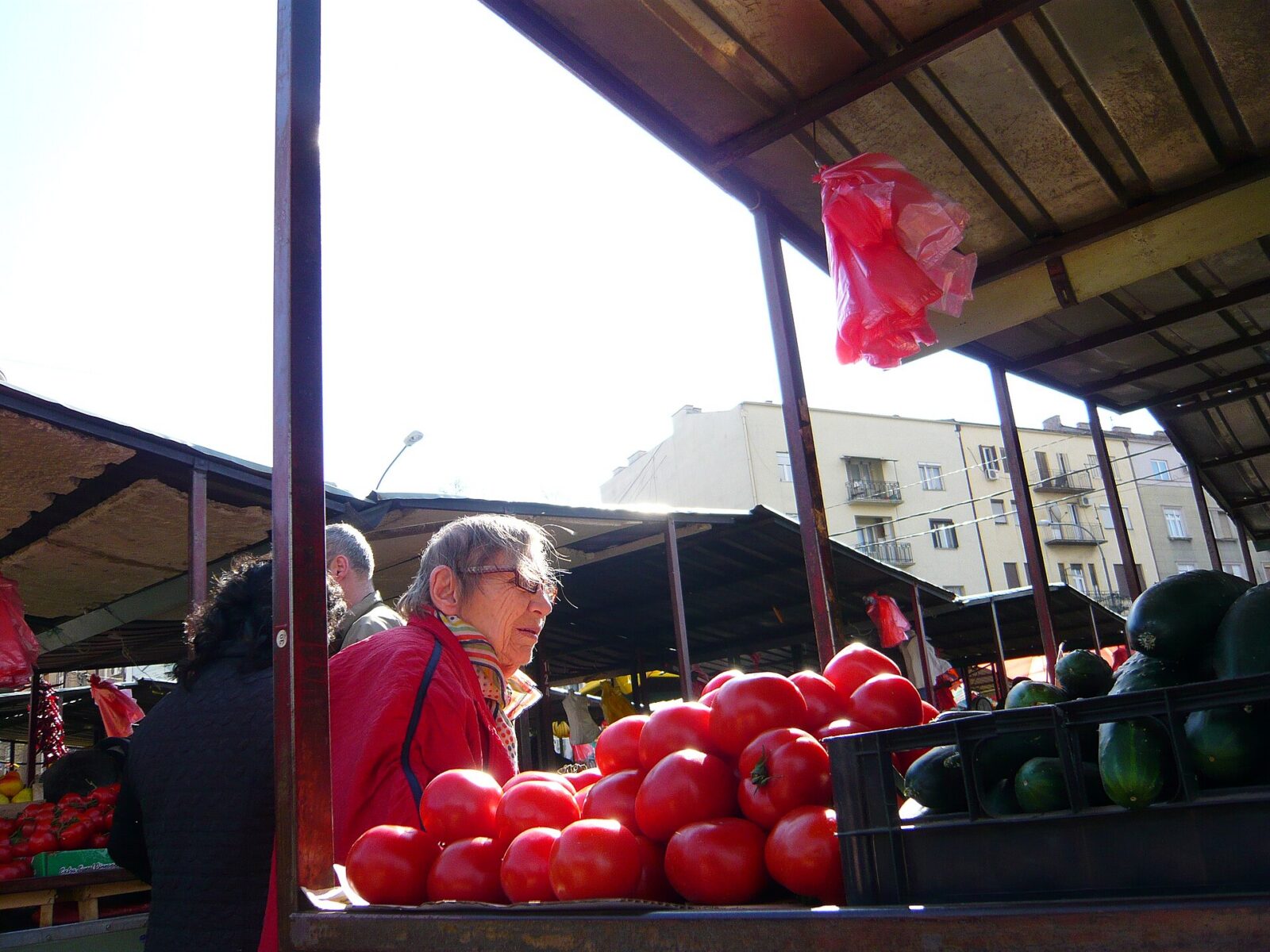 Fruit and vegetable stalls at Kalenic market in Belgrade, with crates of fresh produce displayed for shoppers