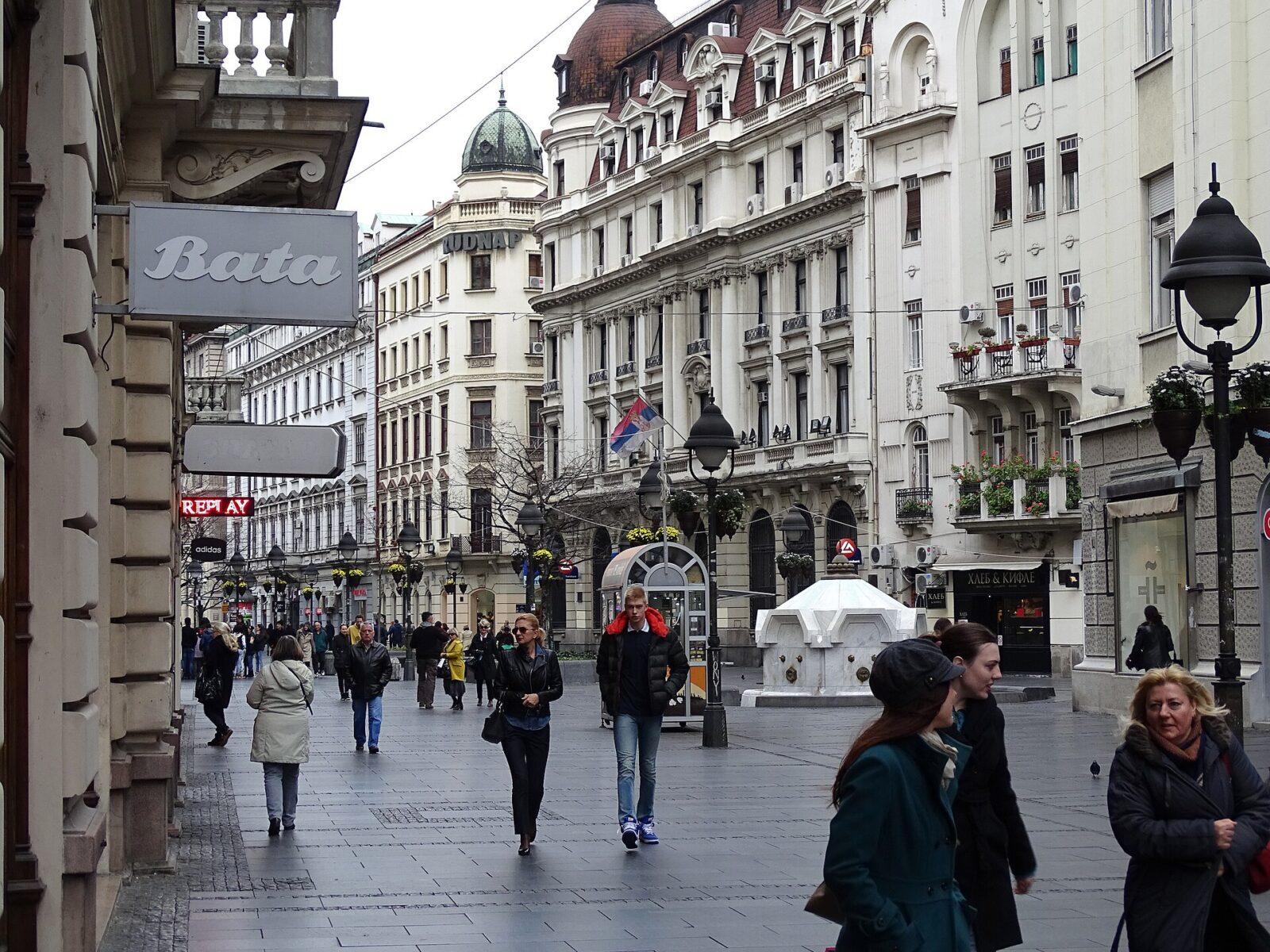 A busy pedestrian shopping street in central Belgrade, the kind of tourist area the advisories warn to watch belongings in
