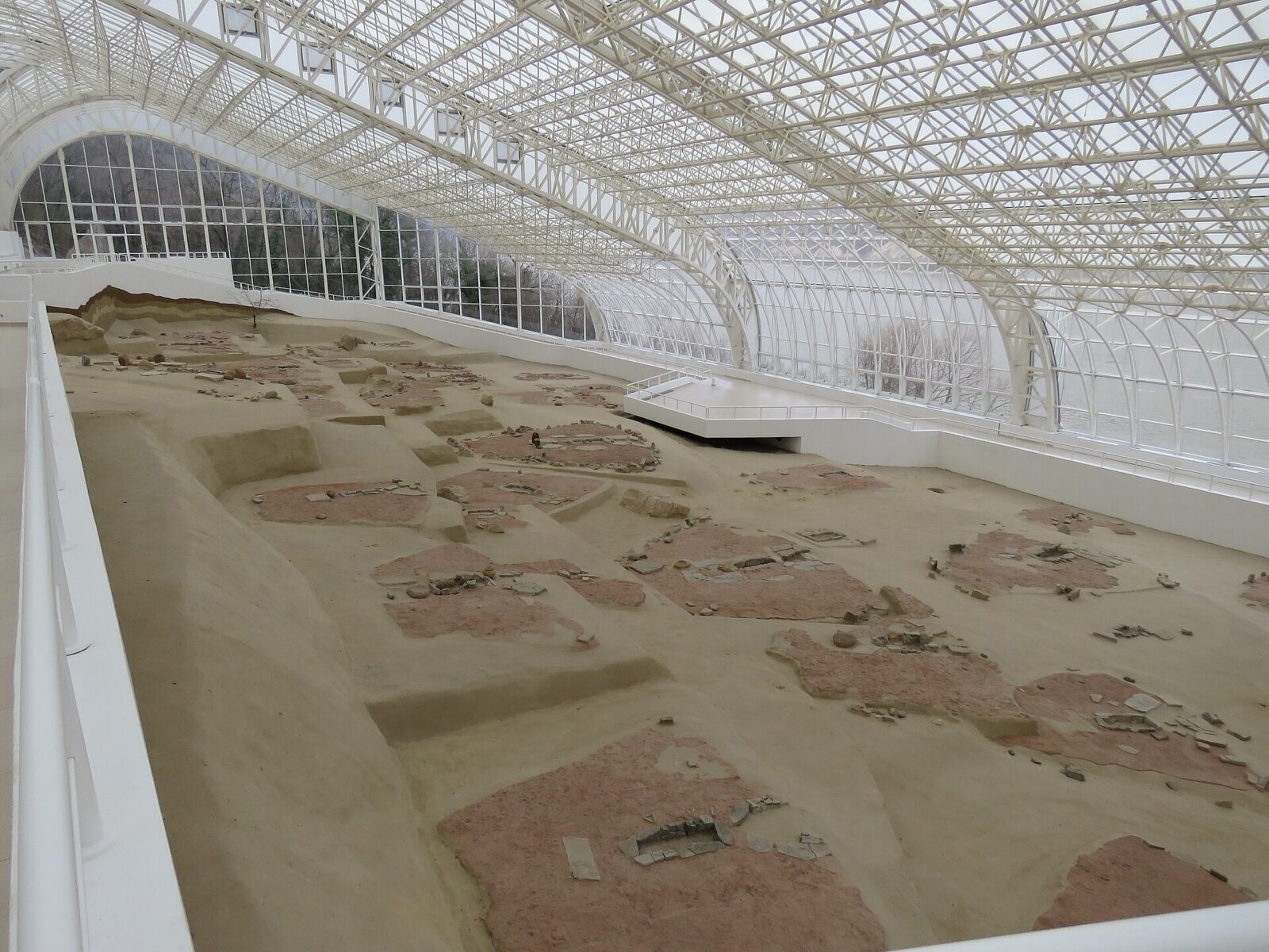 Inside the shelter, looking over the excavated settlement
