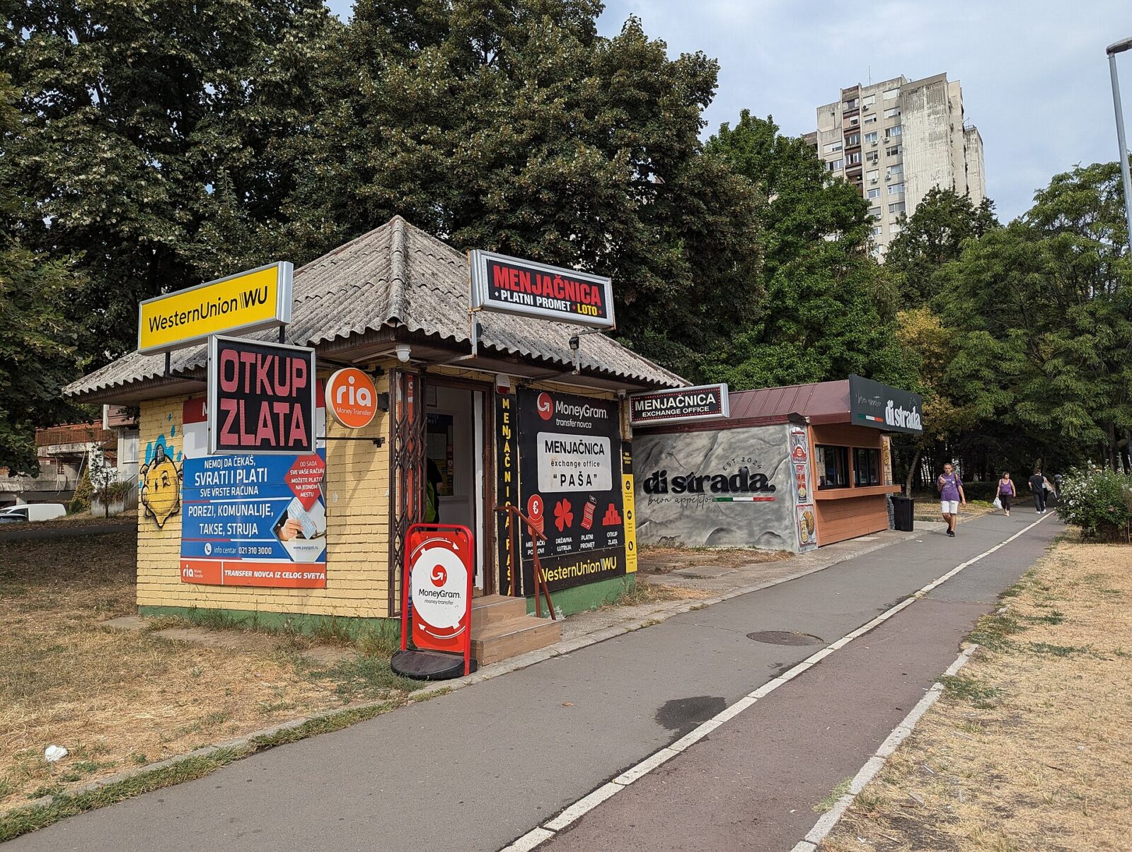 A licensed currency exchange office storefront on a street in central Belgrade