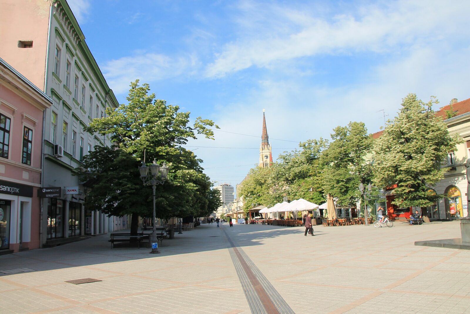 A pedestrian shopping street in central Novi Sad on a clear day