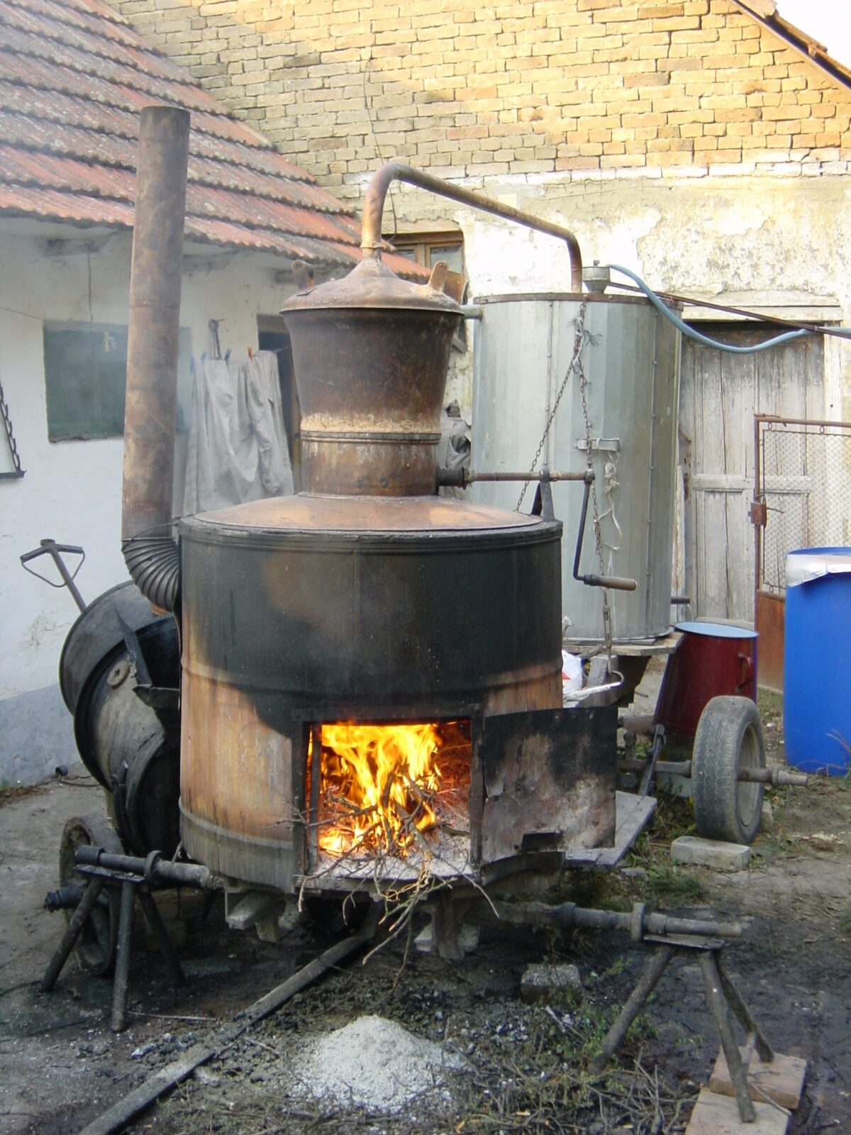 A traditional copper still used for distilling rakija over a wood fire