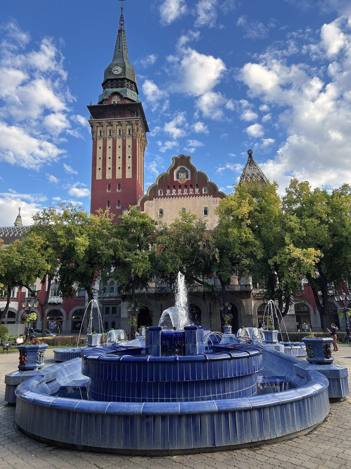 Subotica Town Hall's tower rising behind the Blue Fountain in the main square
