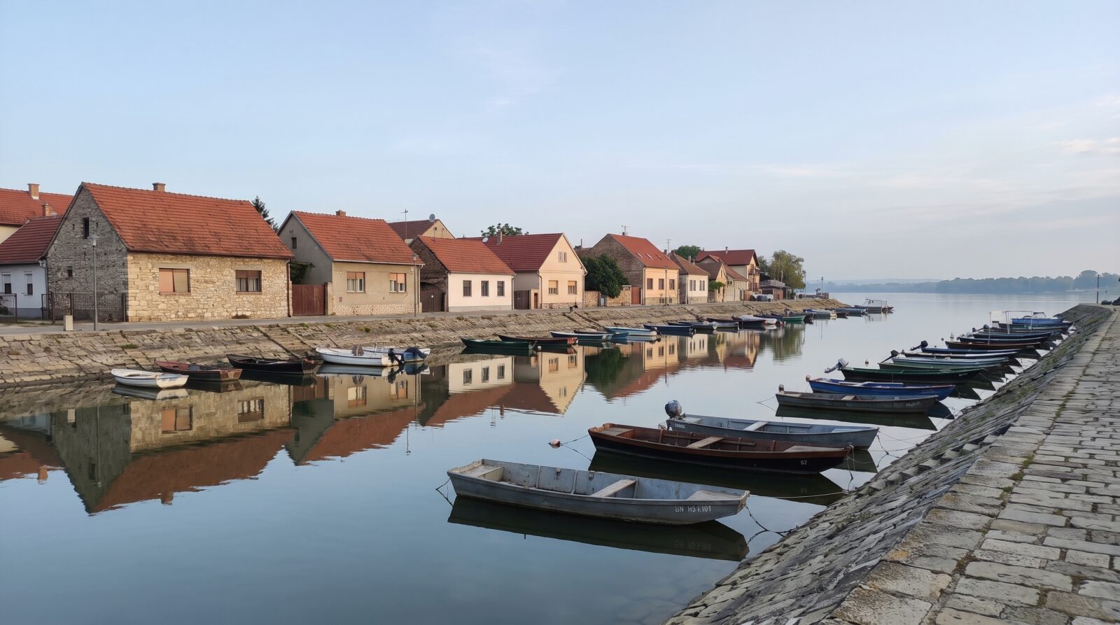 Small boats moored along the Danube quay in Zemun, Belgrade, on a calm morning